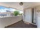 Cozy balcony featuring an apartment door, an outdoor rug, and a partial view of the city skyline at 753 Oakmont Ave # 802, Las Vegas, NV 89109
