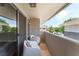 Relaxing outdoor balcony with stylish seating, offering a peaceful space at 753 Oakmont Ave # 802, Las Vegas, NV 89109