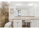 Bathroom vanity featuring granite countertops, a large mirror, ample lighting and a walk-in tiled shower at 753 Oakmont Ave # 802, Las Vegas, NV 89109