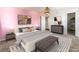 Well-lit bedroom features soft, cozy carpet, stylish furniture, and access to a walk-in closet at 753 Oakmont Ave # 802, Las Vegas, NV 89109