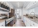 Modern kitchen featuring stainless steel appliances, granite countertops, and light wood-look flooring at 753 Oakmont Ave # 802, Las Vegas, NV 89109