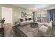 Inviting living room featuring hardwood floors, neutral paint, stylish furniture and a sliding glass door at 753 Oakmont Ave # 802, Las Vegas, NV 89109