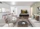 Bright living room with hardwood floors, a modern sofa set, and large TV at 753 Oakmont Ave # 802, Las Vegas, NV 89109