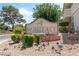 Community sign featuring manicured landscaping and beautiful flowers providing a warm welcome at 753 Oakmont Ave # 802, Las Vegas, NV 89109