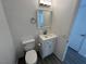 Modern bathroom featuring a vanity, toilet, and wood-look flooring at 8017 Cherish Ave, Las Vegas, NV 89128