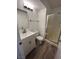 Bright bathroom featuring a modern vanity, shower, and wood-look flooring at 8017 Cherish Ave, Las Vegas, NV 89128