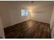 Bedroom with hardwood flooring, bright natural light, and neutral color at 8017 Cherish Ave, Las Vegas, NV 89128