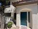 Close-up of the home's entrance highlighting the address, green door and welcome mat at 8017 Cherish Ave, Las Vegas, NV 89128