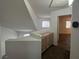 Upstairs hallway with built in cabinets and wood look flooring at 8017 Cherish Ave, Las Vegas, NV 89128