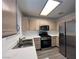 Bright kitchen featuring stainless steel appliances, ample counter space, and modern cabinetry at 8017 Cherish Ave, Las Vegas, NV 89128