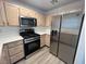 Well-equipped kitchen featuring stainless steel appliances and sleek countertops at 8017 Cherish Ave, Las Vegas, NV 89128