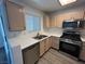 Stylish kitchen showcasing stainless steel appliances and light wood cabinets at 8017 Cherish Ave, Las Vegas, NV 89128
