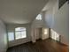Lofted ceilings and oversized windows let plenty of natural light into the living room at 8017 Cherish Ave, Las Vegas, NV 89128