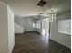 Spacious living area with updated flooring, natural light, and a modern ceiling fan at 8017 Cherish Ave, Las Vegas, NV 89128