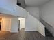 Spacious living room showcasing the staircase and an open layout at 8017 Cherish Ave, Las Vegas, NV 89128