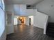 Open living room floor plan features wood floors and plenty of natural light at 8017 Cherish Ave, Las Vegas, NV 89128