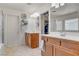 Bright bathroom featuring double sinks, a separate shower, and a soaking tub perfect for relaxation and comfort at 831 E Galingale Ct, Henderson, NV 89015