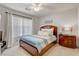 Comfortable bedroom with a wooden bed frame, light walls, and lots of natural light creating a serene retreat at 831 E Galingale Ct, Henderson, NV 89015