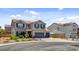 A well-manicured two-story home boasting a two-car garage, complemented by a beautiful landscape at 831 E Galingale Ct, Henderson, NV 89015