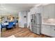 Spacious kitchen and dining area with stainless steel appliances and access to the living area at 831 E Galingale Ct, Henderson, NV 89015