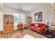 Cozy living room featuring laminate floors and a collection of vintage furniture and decor at 831 E Galingale Ct, Henderson, NV 89015