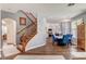 Open floor plan featuring staircase to second floor, view to dining area and sight lines through the home at 831 E Galingale Ct, Henderson, NV 89015