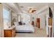 Spacious main bedroom boasts a unique ceiling fan, natural light and neutral tones, creating a cozy and inviting atmosphere at 831 E Galingale Ct, Henderson, NV 89015