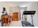 Versatile spare room featuring a desk, dresser, and treadmill, perfect for both work and exercise needs at 831 E Galingale Ct, Henderson, NV 89015