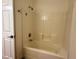 Bright bathroom featuring a white tiled tub and shower at 855 N Stephanie St # 2311, Henderson, NV 89014