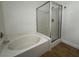 Bathroom features a bathtub with tile surround and glass shower doors for a clean and modern look at 855 N Stephanie St # 2311, Henderson, NV 89014