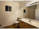 Well-lit bathroom featuring a large mirror, wood-look flooring, and a modern vanity at 855 N Stephanie St # 2311, Henderson, NV 89014