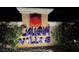 Galleria Villas community sign at night with lush landscaping at 855 N Stephanie St # 2311, Henderson, NV 89014