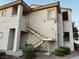 Exterior view of the condominium building with a stairway to the second level at 855 N Stephanie St # 2311, Henderson, NV 89014