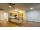 Modern kitchen with stainless steel appliances, connecting to a spacious living area at 855 N Stephanie St # 2311, Henderson, NV 89014