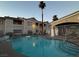 Community pool with seating and fencing around apartment homes at 855 N Stephanie St # 2311, Henderson, NV 89014