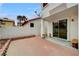 Enclosed backyard featuring a red brick patio and stucco walls at 8789 Villa Alex Ave, Las Vegas, NV 89147