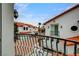 Balcony view of the surrounding neighborhood with wrought iron railings and tile roofs at 8789 Villa Alex Ave, Las Vegas, NV 89147