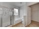 Bathroom featuring a tiled shower, soaking tub, and natural light, providing a clean and modern space at 8789 Villa Alex Ave, Las Vegas, NV 89147