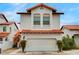 Charming two-story home featuring a Spanish-style roof and an attached two-car garage at 8789 Villa Alex Ave, Las Vegas, NV 89147