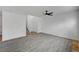 Spacious living room with light gray flooring and a modern ceiling fan with lighting at 8789 Villa Alex Ave, Las Vegas, NV 89147