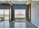 Bedroom featuring city view, oversized windows, and access to a patio at 900 Las Vegas Blvd # 1209, Las Vegas, NV 89101