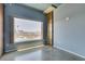 View of the city with a bedroom featuring stone column and an oversized window at 900 Las Vegas Blvd # 1209, Las Vegas, NV 89101