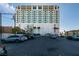 Contemporary apartment building with parking and manicured landscaping at 900 Las Vegas Blvd # 1209, Las Vegas, NV 89101