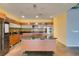 Modern kitchen with stainless steel appliances, granite countertops, and a kitchen island with cooktop at 900 Las Vegas Blvd # 1209, Las Vegas, NV 89101