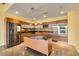 Modern kitchen with stainless steel appliances, an island, and sleek wood cabinets at 900 Las Vegas Blvd # 1209, Las Vegas, NV 89101
