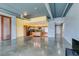 Open concept featuring concrete floors, blue and yellow walls, and stainless steel appliances at 900 Las Vegas Blvd # 1209, Las Vegas, NV 89101