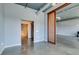 Modern living space with a view to a bathroom, open layout, and sleek concrete floors at 900 Las Vegas Blvd # 1209, Las Vegas, NV 89101