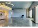 Open living room featuring concrete floors, blue and yellow walls, and modern lighting at 900 Las Vegas Blvd # 1209, Las Vegas, NV 89101