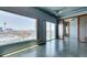 Spacious living room featuring city views, concrete floors, and sliding glass doors to a balcony at 900 Las Vegas Blvd # 1209, Las Vegas, NV 89101