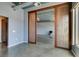 Open-concept living area featuring unique sliding wood doors and concrete floors at 900 Las Vegas Blvd # 1209, Las Vegas, NV 89101